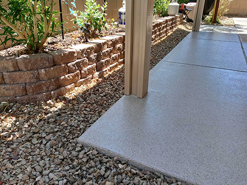 patio with floor coating and plants