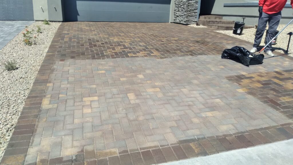 gray home with pavers before clean and seal and professional working