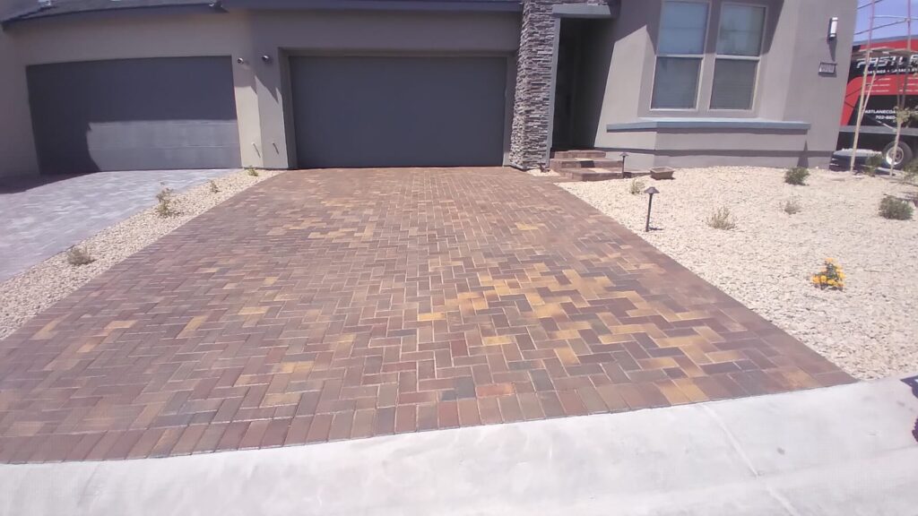 gray home with pavers after clean and seal