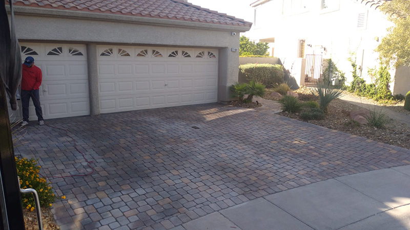 brown home with pavers before clean and seal